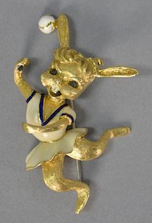 Martine 18K gold dancing rabbit with enameled dress and sapphire eyes, marked Martine. lg. 2 1/4in., 19.2 grams