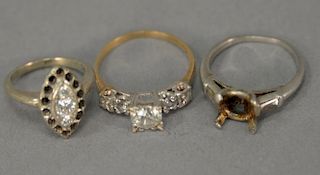 Three piece lot with two diamond rings and one platinum setting. 8.8 total grams