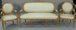Louis XVI three piece suite to include canape with gilt frame and pair of fauteuil. ht. 40in., wd. 64in. Provenance: Collecti