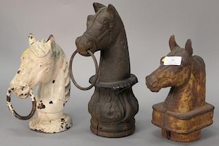 Three piece lot with three iron horsehead hitching post tops. ht. 9 3/4in. to 13in. Provenance: Estate of Arthur C. Pinto, MD