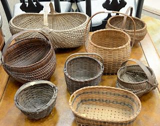 Eight piece basket lot. largest: ht. 13in., lg. 20in. Provenance: Estate of Arthur C. Pinto, MD