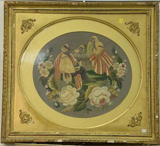 Three 19th century framed needlepoints including small nativity Madonna and Child, oval framed silk needlepoint of two people