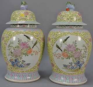 Pair of Chinese porcelain covered jars, late 20th century (1 top finial as is). ht. 18 1/2in.