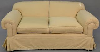 Custom upholstered loveseat having two down filled cushions. lg. 67in. Provenance: From an apartment on Park Avenue, New York