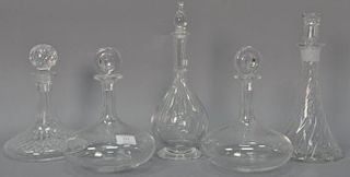 Five decanters including three Baccarat, one Waterford, and one Orrefors. ht. 10in. to 13 1/2in.