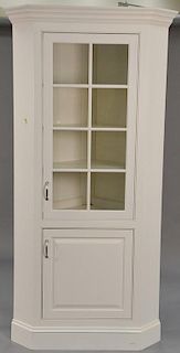 Custom corner cabinet in professional white finish. ht. 84in., wd. 38in.