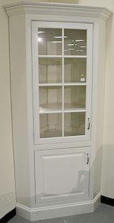 Custom corner cabinet in professional white finish. ht. 84in., wd. 38in.