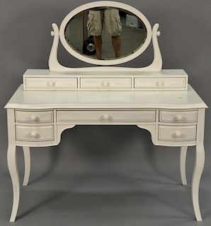 White vanity and mirror. ht. 64in, wd. 48in. Provenance: From an apartment on Park Avenue, New York.