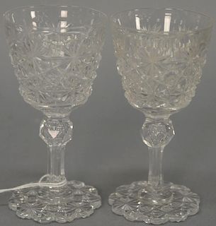 Set of eight cut glass stems with petal bases (chips). ht. 4 1/2in.