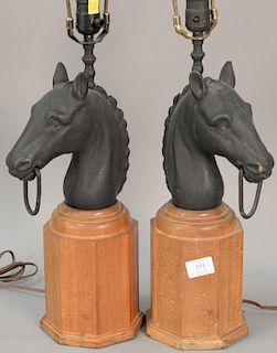 Pair of iron horse head hitching post tops, made into table lamps. total ht. 30in.