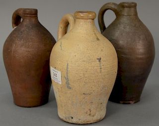 Three stoneware jugs including one with incised line decoration. ht. 8in. to 8 1/2in. Provenance: Estate of Arthur C. Pinto, 