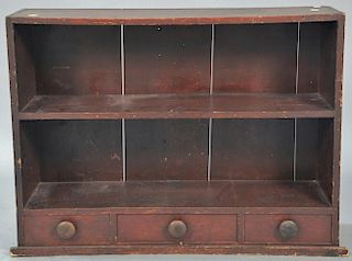 Primitive bookcase with three short drawers. ht. 26in., wd. 35in., dp. 10in. Provenance: Estate of Arthur C. Pinto, MD