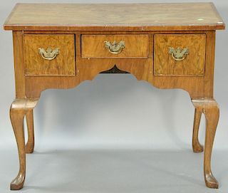 Burl mahogany veneered dressing table. ht. 28in., wd. 35 1/2in., dp. 19 1/2in.