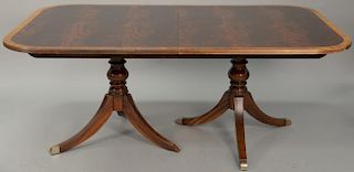 Ethan Allen mahogany dining table with banded inlaid top and double pedestal base and glass cut to fit top (minor imperfectio