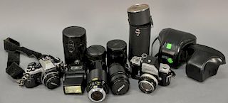 Two Nikon cameras, F and FA plus lenses.