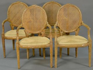 Set of four caned armchairs with rush seats having naturalistic branch framework, each with custom cushion. ht. 40in.