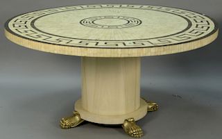 Inlaid top round table bone and ebony on pedestal base with brass paw feet (minor imperfections). ht. 29 1/2in., dia. 60in.