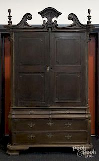 Chippendale mahogany press cupboard, ca. 1760, probably Caribbean, with a broken arch crest with fla