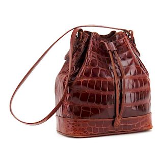 Lana Marks Russet Crocodile Drawstring Bucket Bag. Suede Interior with zipper pocket.