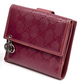 GUCCI PINK EMBOSSED MONOGRAM COMPACT WALLET