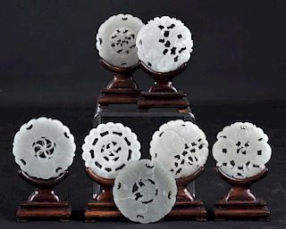 7 Chinese Carved Jade Bi-Discs with Rosewood Stand