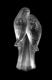 A Lalique Molded and Frosted Glass Figural Group, Height 7 3/8 inches.