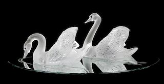 A Pair of Lalique Molded and Frosted Glass Figures, Height of taller 9 3/4 inches.