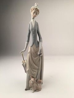 Vintage Lladro matt porcelain figurine of a woman with an umbrella to her side