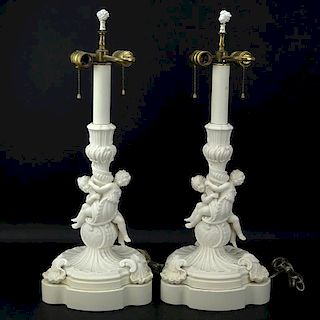 Pair of 19/20th Century Sevres Style Bisque Cherub Figural Lamps with Cherub Finials.