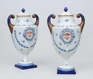 PAIR OF CHINESE EXPORT PORCELAIN STYLE PISTOL-HANDLED URNS AND COVERS