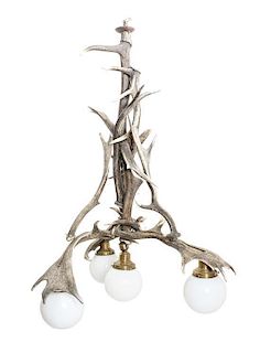 A Caribou Antler Four-Light Chandelier Height 39 inches.