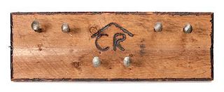 An Original Wood and Railroad Spike Coat Rack Height 11 3/4 x width 35 inches.