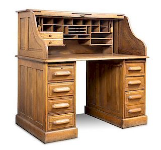 An American Oak Roll Top Desk Height 49 x width 49 1/2 x depth 31 1/2 inches.