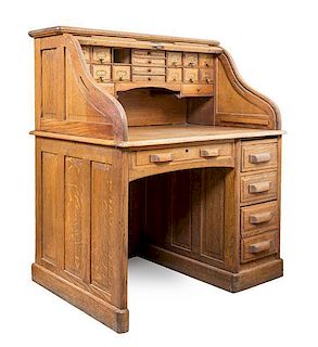 An American Oak Roll Top Desk Height 49 3/4 x width 41 x depth 31 inches.