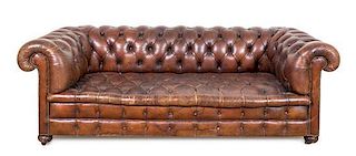 A Leather Upholstered Chesterfield Sofa Height 28 x width 80 x depth 36 inches.