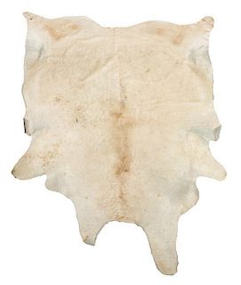 A Cow Hide Rug. Length approximately 100 x width 81 inches.