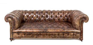 A Leather Upholstered Chesterfield Sofa Height 28 x width 81 x depth 36 inches.