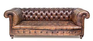 A Leather Upholstered Chesterfield Sofa Height 29 x width 78 x depth 38 inches.