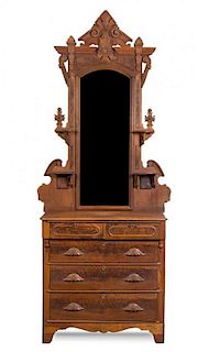 An Eastlake Style Mahogany and Burlwood Dresser Height approximately 112 x width 40 x depth 19 inches.