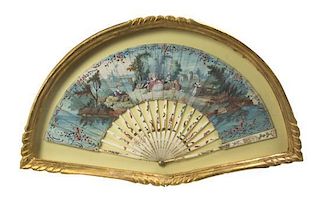 A French Painted Paper Fan, CIRCA 1800, Height of frame 14 x width 23 1/4 inches.