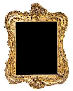 A Louis XV Style Giltwood Mirror, SECOND HALF 19TH CENTURY, 59 x 44 inches.