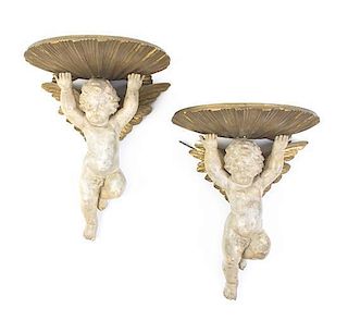 A Pair of Louis XV Style Painted and Gilt Plaster Figural Wall Brackets, Height 14 1/2 inches.