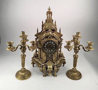 Antique bronze Gothic clock and two candlabras.<BR>
