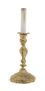A Louis XV Style Gilt Bronze Candlestick, Height overall 21 1/4 inches.