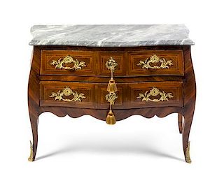 A Louis XV Gilt Bronze Mounted Parquetry Commode, LATE 18TH CENTURY, Height 36 x width 49 1/2 x depth 23 inches.