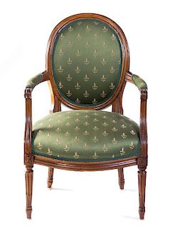 A Louis XVI Walnut Fauteuil, LATE 18TH/EARLY 19TH CENTURY, Height 36 1/2 inches.