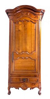 A Louis XVI Provincial Walnut Armoire, 19TH CENTURY, WITH ALTERATION, Height 86 x width 44 x depth 22 1/2 inches.