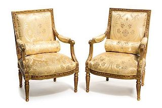 A Pair of Louis XVI Style Gilt and Gesso Fauteuils, 20TH CENTURY, Height 39 inches.