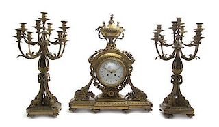 A Louis XVI Style Gilt Bronze Clock Garniture, LIKELY LATE 19TH CENTURY, Height of clock 26 1/2 inches.