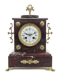 A French Gilt Metal Mounted Rouge Marble Clock, Height 13 1/4 inches.